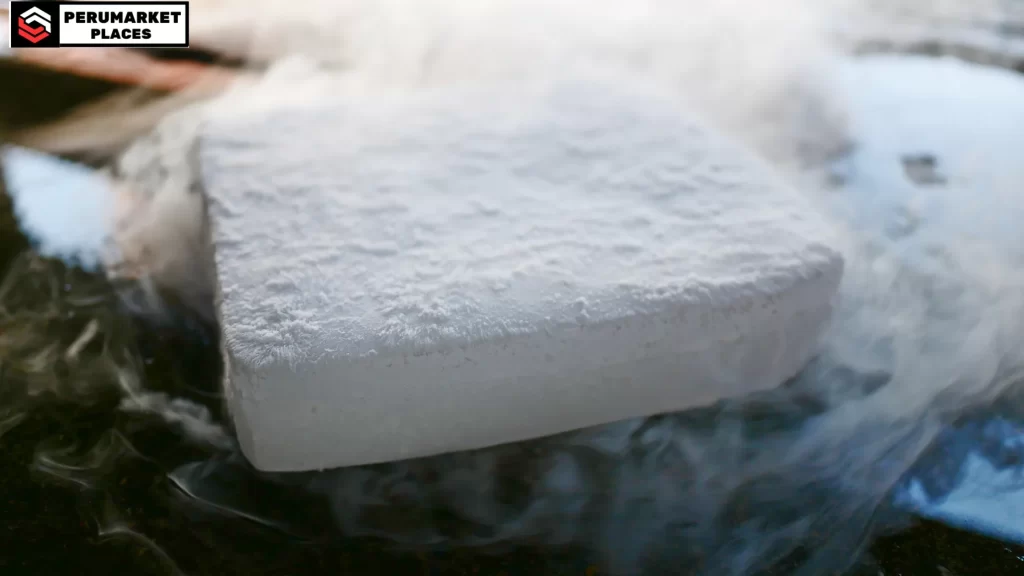 A solid block of dry ice sublimating, highlighting how long dry ice lasts.