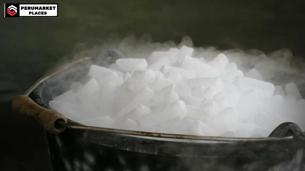 A bucket of dry ice sublimating into mist, showcasing how long dry ice lasts.